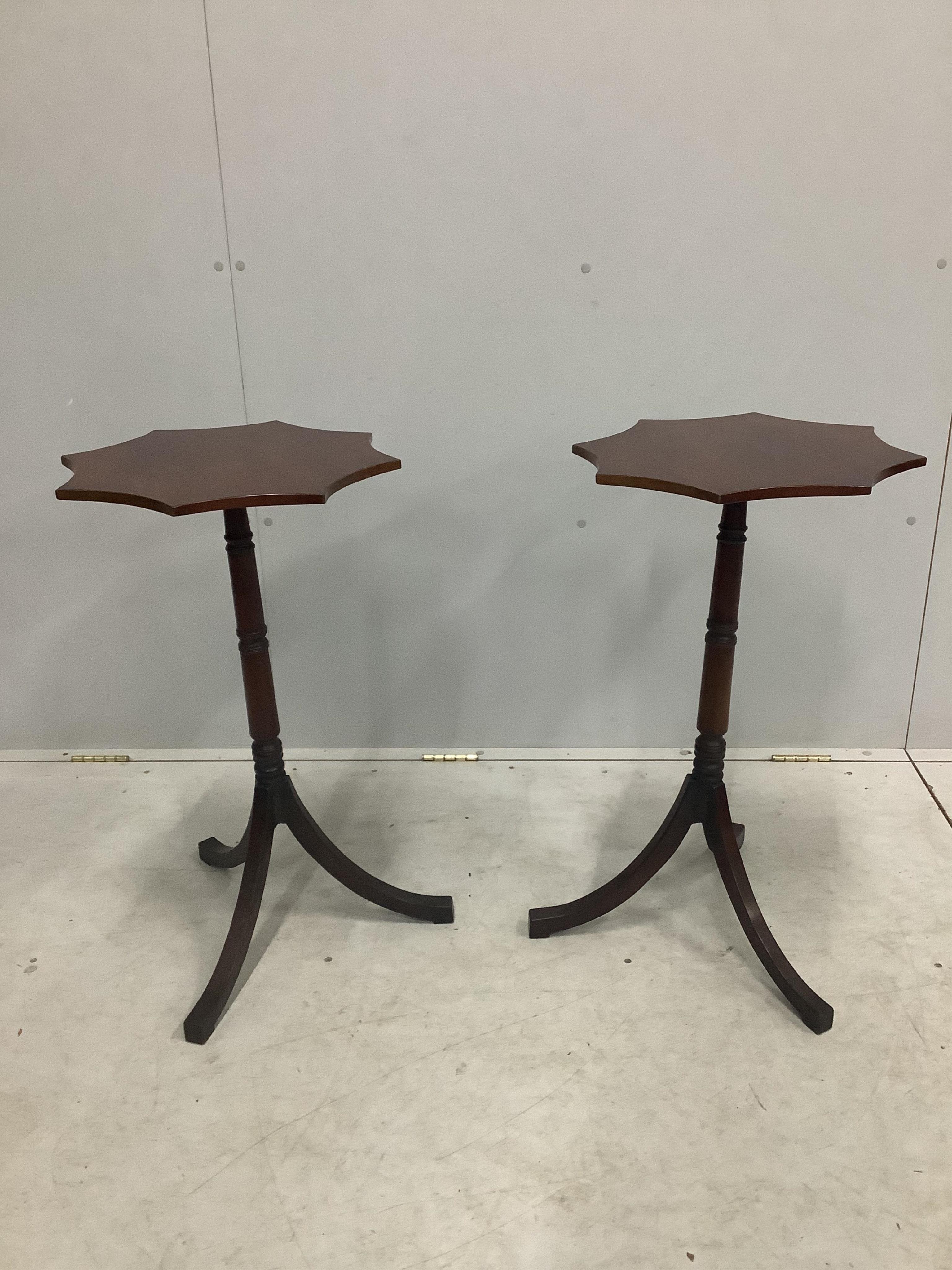 A pair of Regency style mahogany tripod wine tables, width 43cm, height 74cm. Condition - fair to good